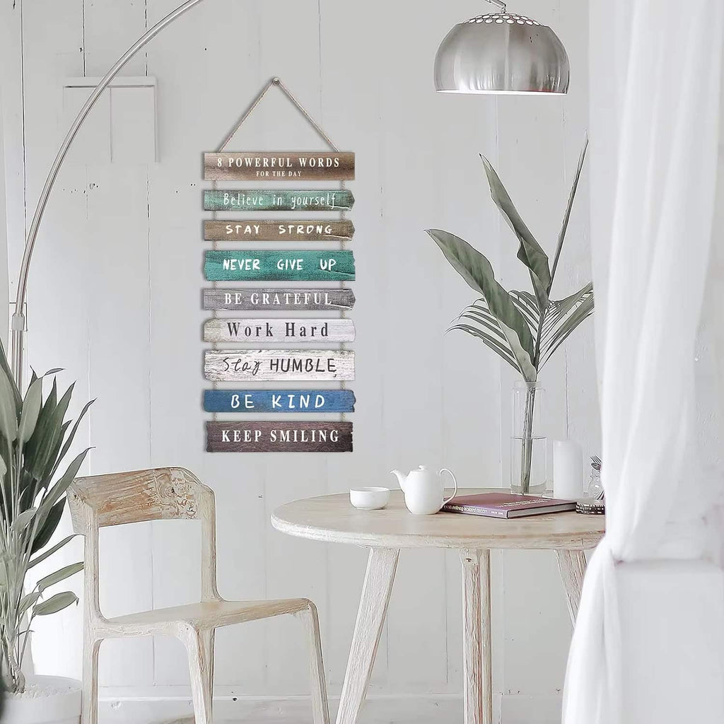 Hanging wood slat wall sign with positive quotes in soft colors