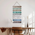 Hanging wood slat wall sign with positive quotes in soft colors