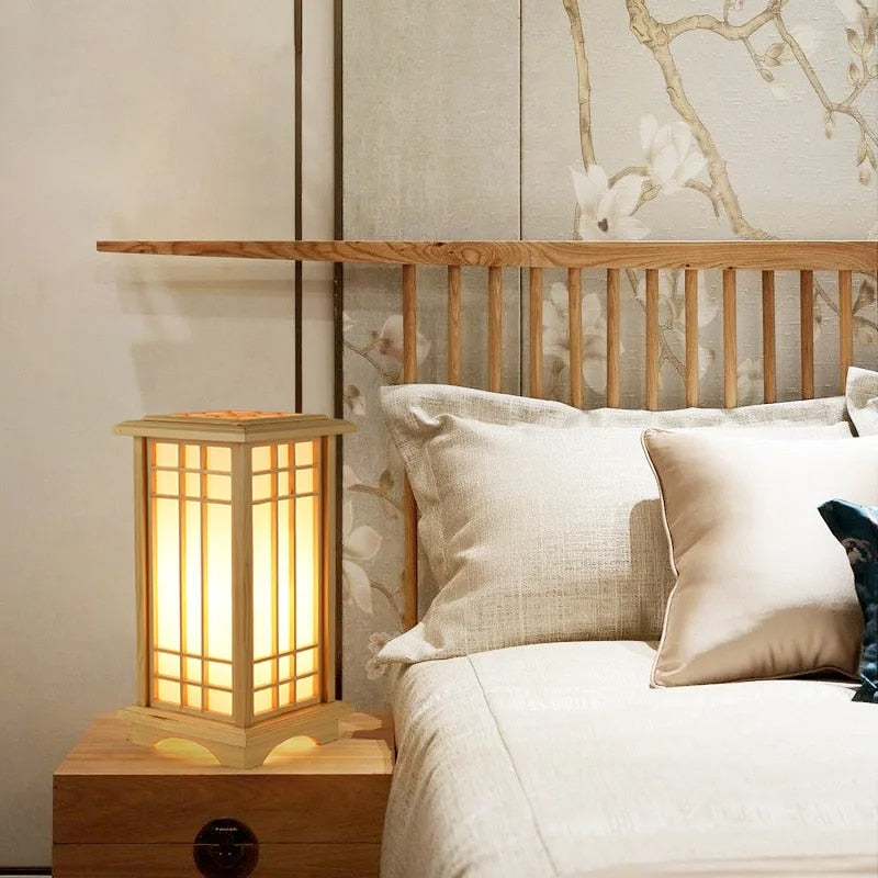 Japanese lantern style bedside lamp in light wood with fine slats and fabric