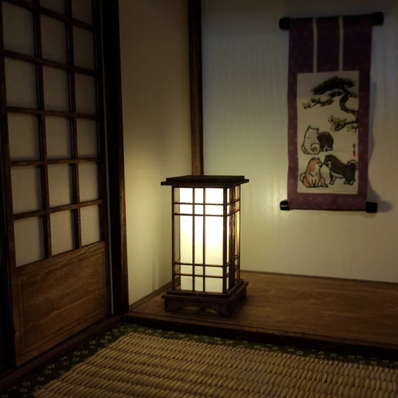 Japanese lantern style bedside lamp in light wood with fine slats and fabric