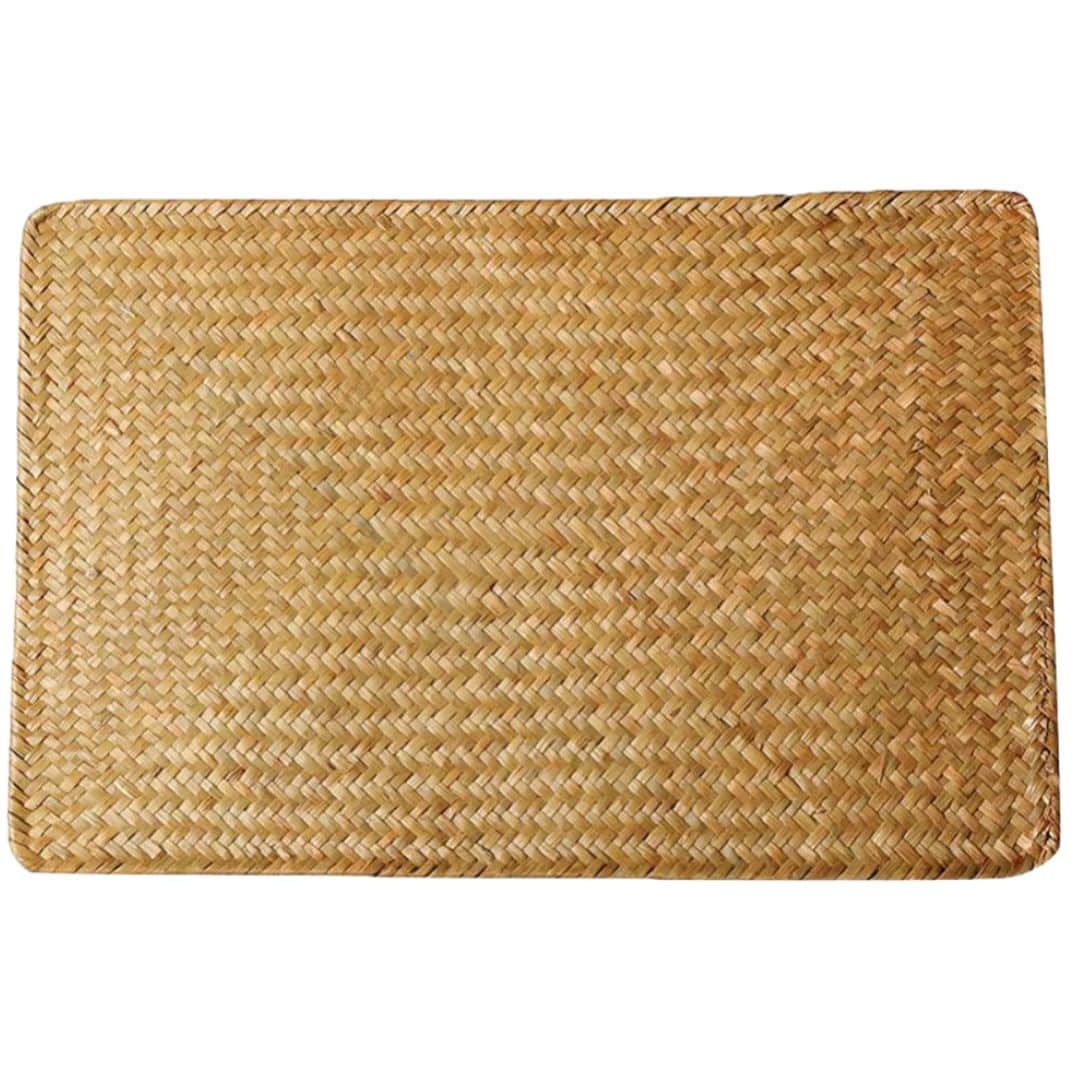 Rectangular placemat of flat woven natural bamboo slats in a Japanese style