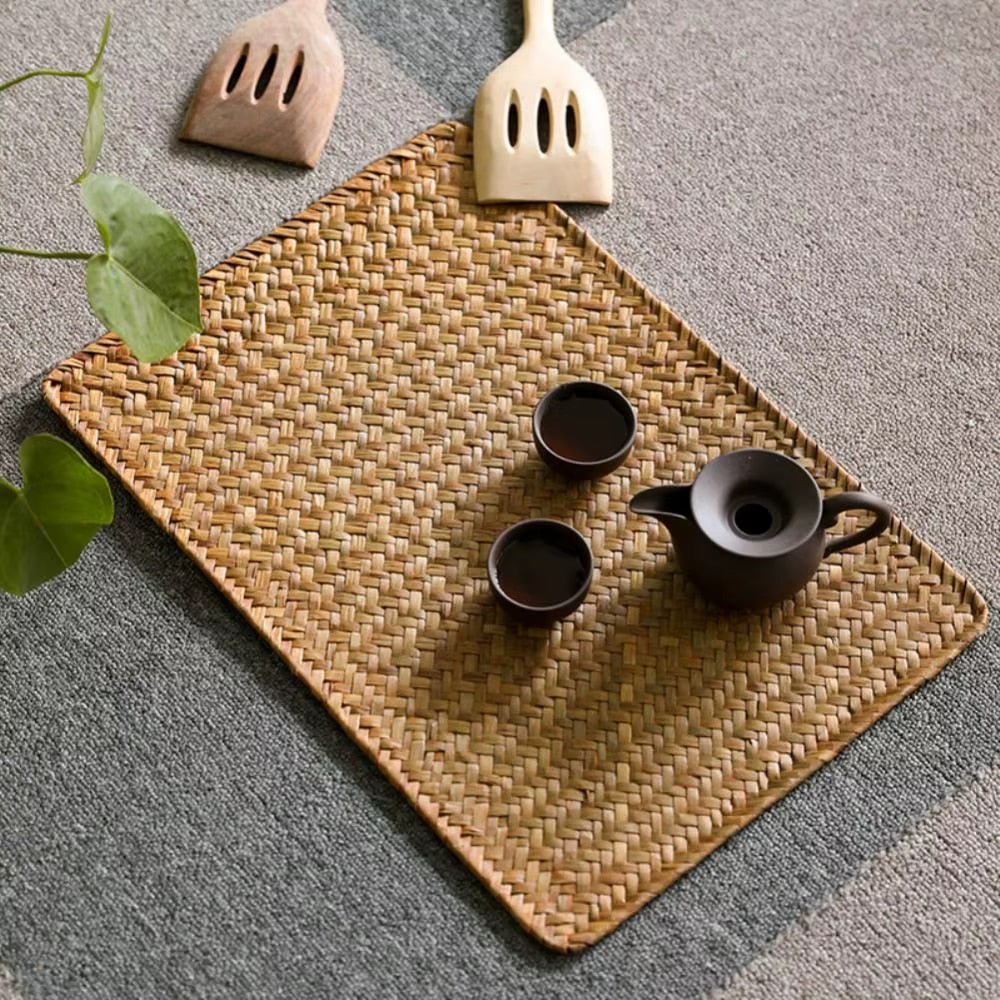 Rectangular placemat of flat woven natural bamboo slats in a Japanese style