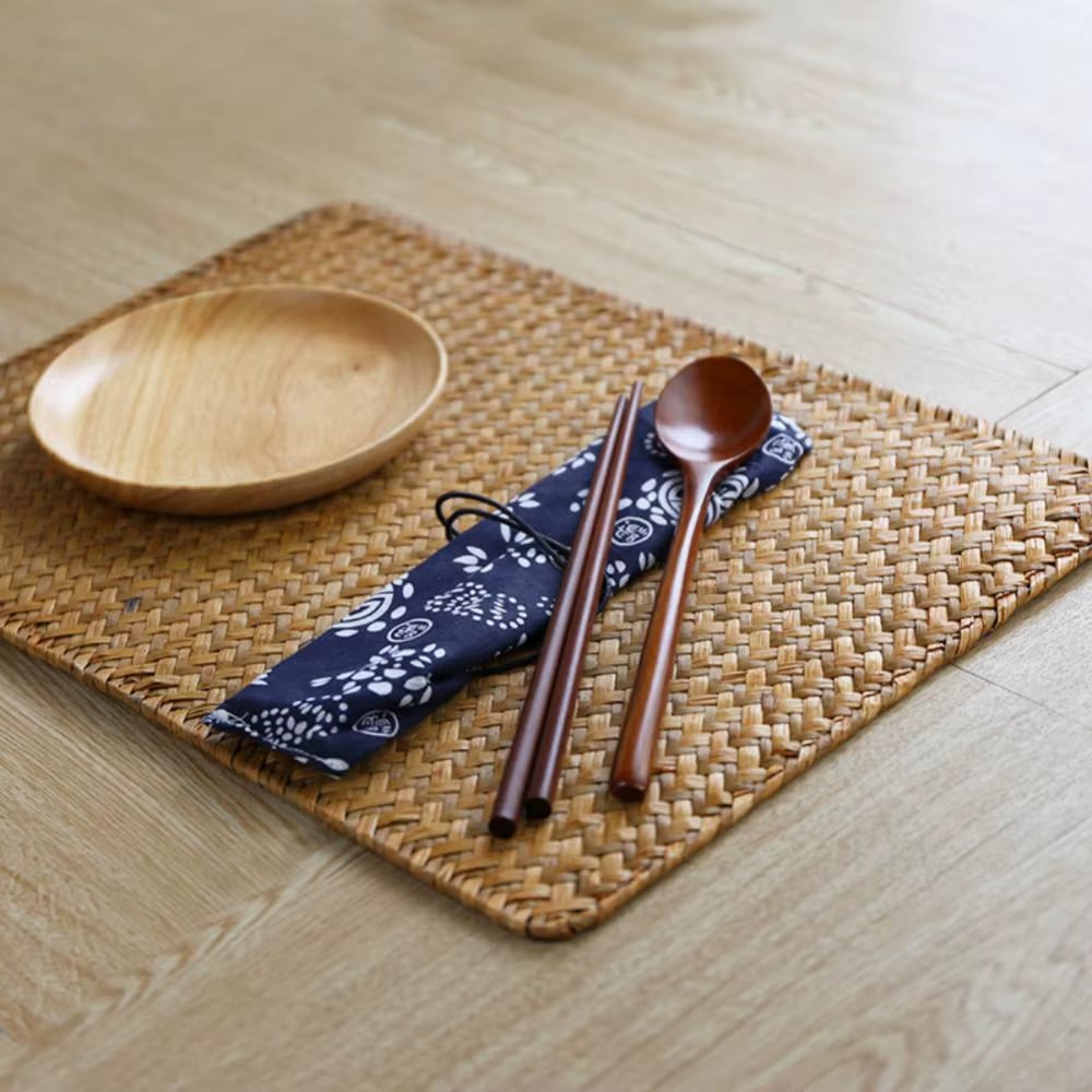 Rectangular placemat of flat woven natural bamboo slats in a Japanese style