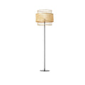 Japanese style floor lamp with a curved hand woven rattan shade and a dark metal stand