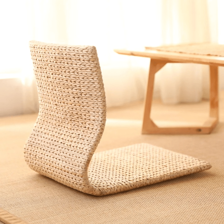 Low legless floor chair hand woven in rattan and wicker in a Japanese style
