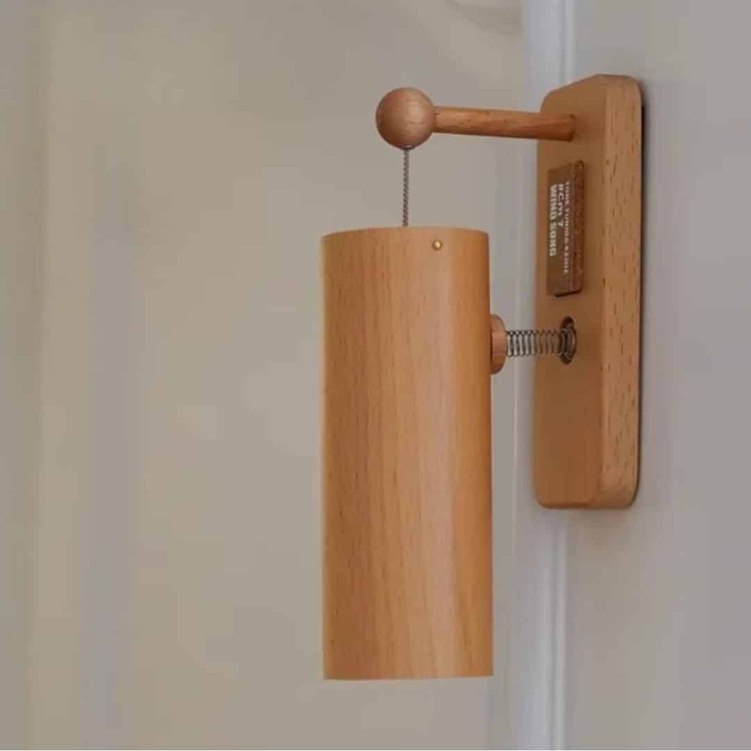 Japanese style wooden wall door chime with a hanging bamboo tube