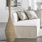 Japanese lantern style standing lamp with tight hand woven wicker slats on a wood base