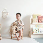 Small square hand woven rattan armchair for children in a natural tone