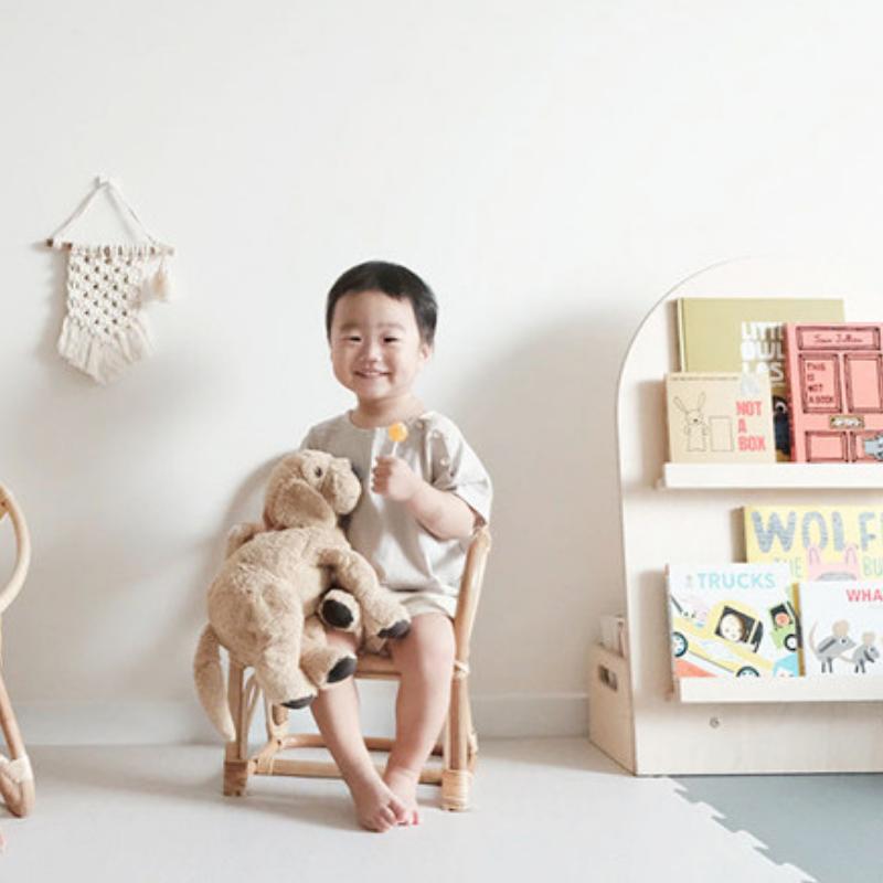 Small square hand woven rattan armchair for children in a natural tone