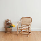 Small square hand woven rattan armchair for children in a natural tone