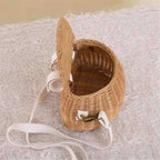 Small lidded wicker kids basket with a white strap