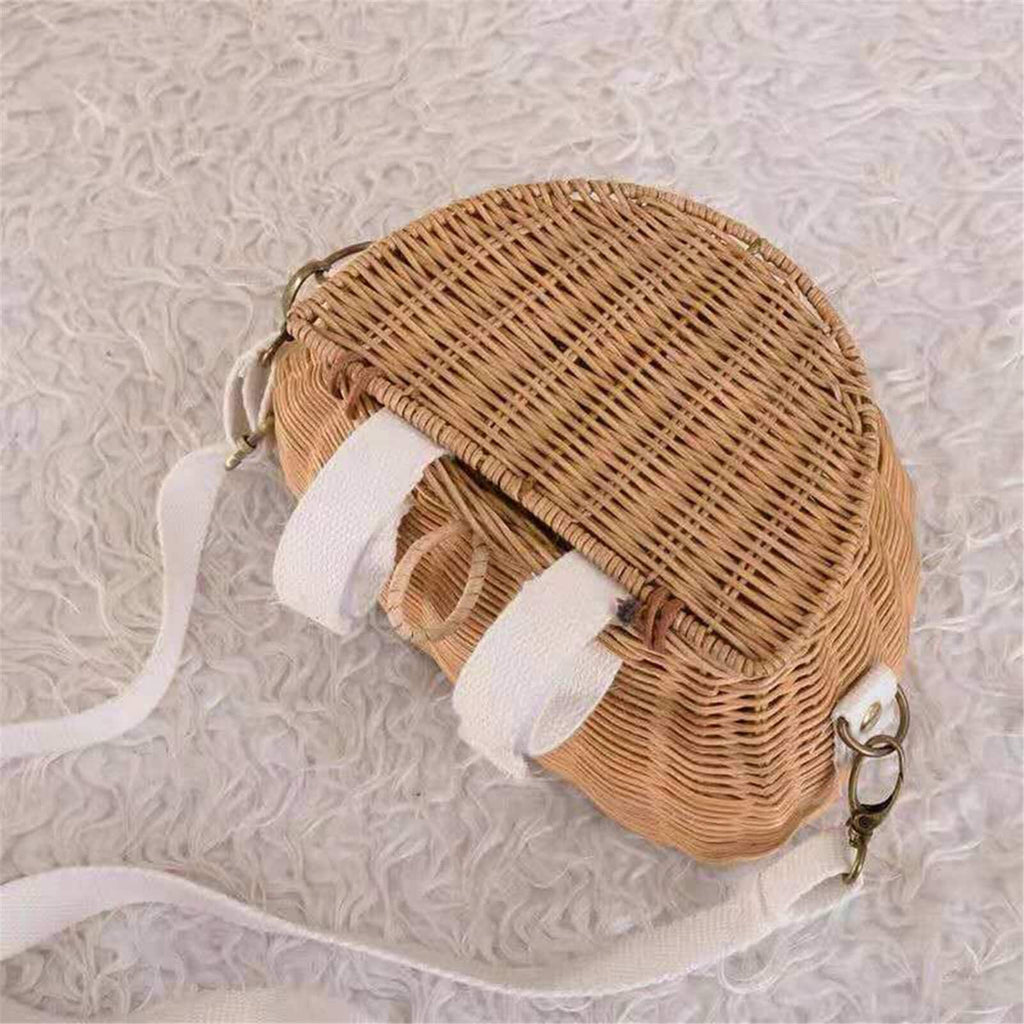 Small lidded wicker kids basket with a white strap