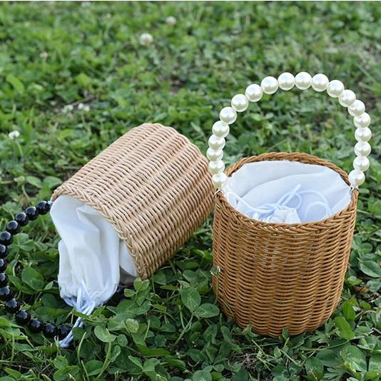 Small woven basket with bead handle and white drawstring liner