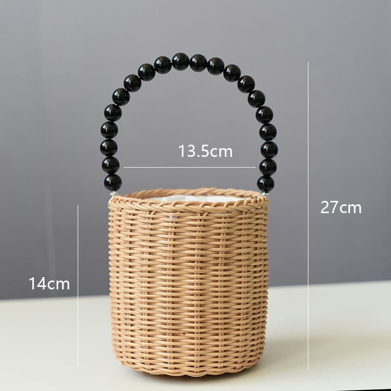 Small woven basket with bead handle and white drawstring liner