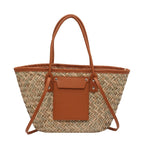 Large natural brown hand woven straw summer bag with two sturdy handles