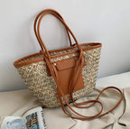 Large natural brown hand woven straw summer bag with two sturdy handles