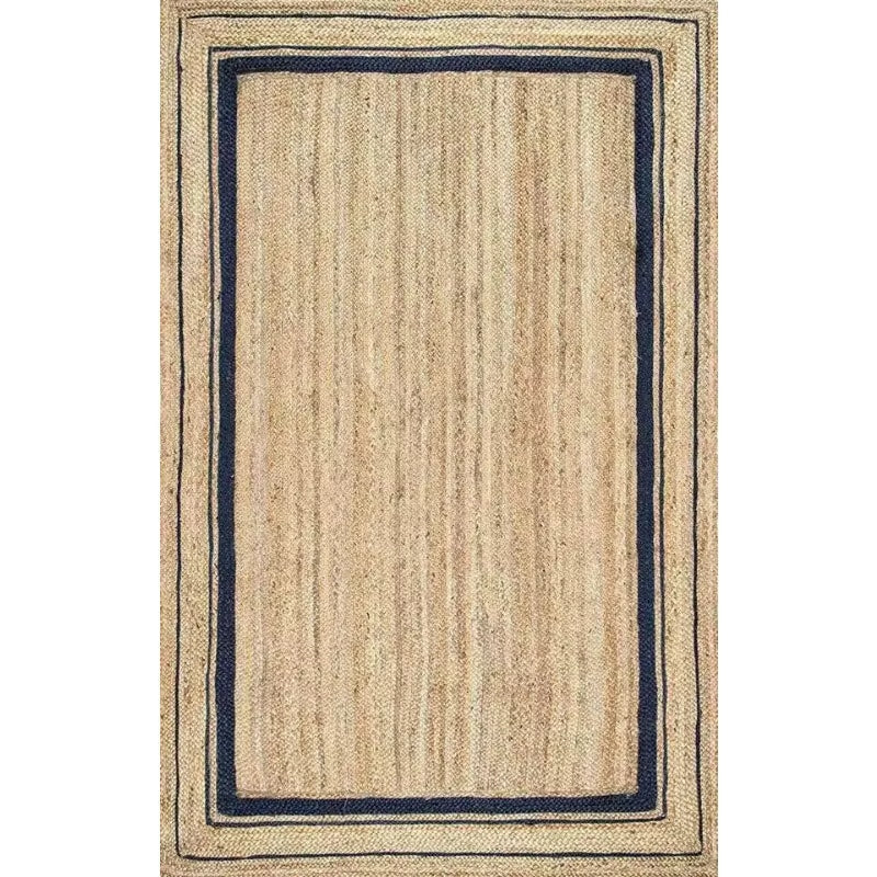 Large rectangular jute rug framed by thin navy lines