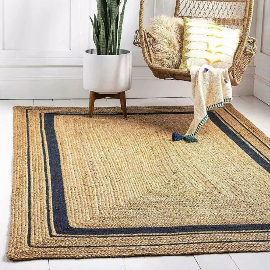 Large rectangular jute rug framed by thin navy lines