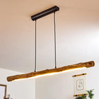 Large horizontal natural wood log pendant light on an iron structure