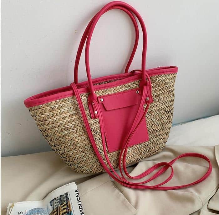 Large soft pink hand woven straw summer bag with two sturdy handles