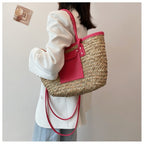 Large soft pink hand woven straw summer bag with two sturdy handles