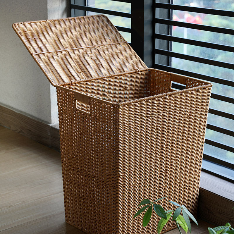 Large brown woven rattan trash can with a lid and two side handles