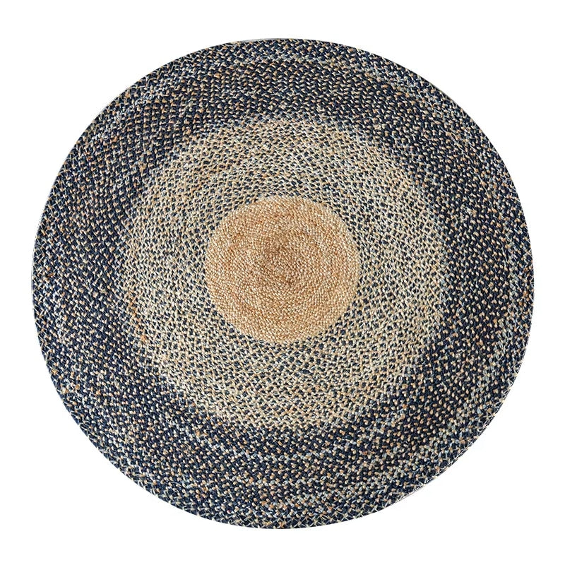 Large round braided rug with a natural center and dark blue gray rings