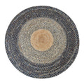 Large round braided rug with a natural center and dark blue gray rings