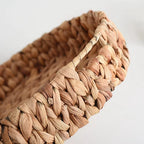 Large round handwoven rattan tray with raised edges