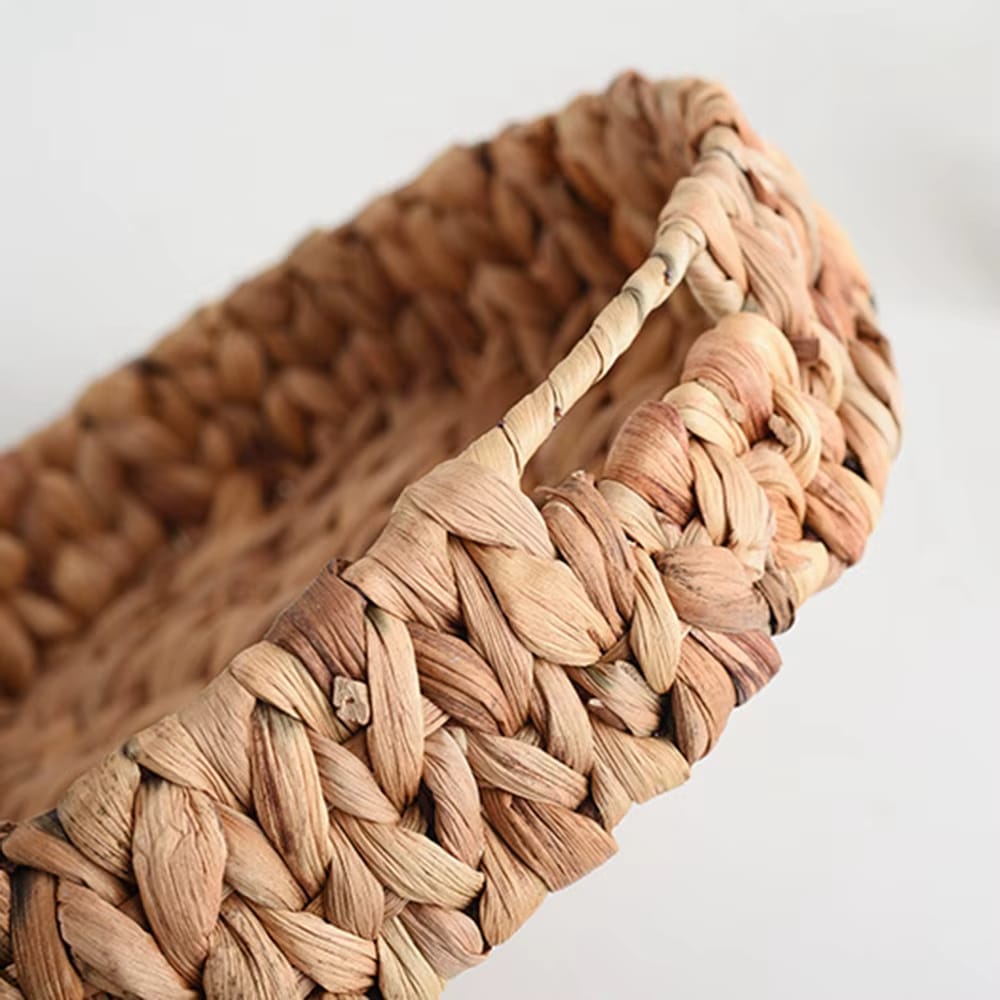 Large round handwoven rattan tray with raised edges