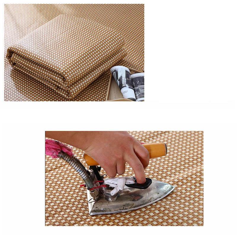 Large square woven rattan mat under a low table