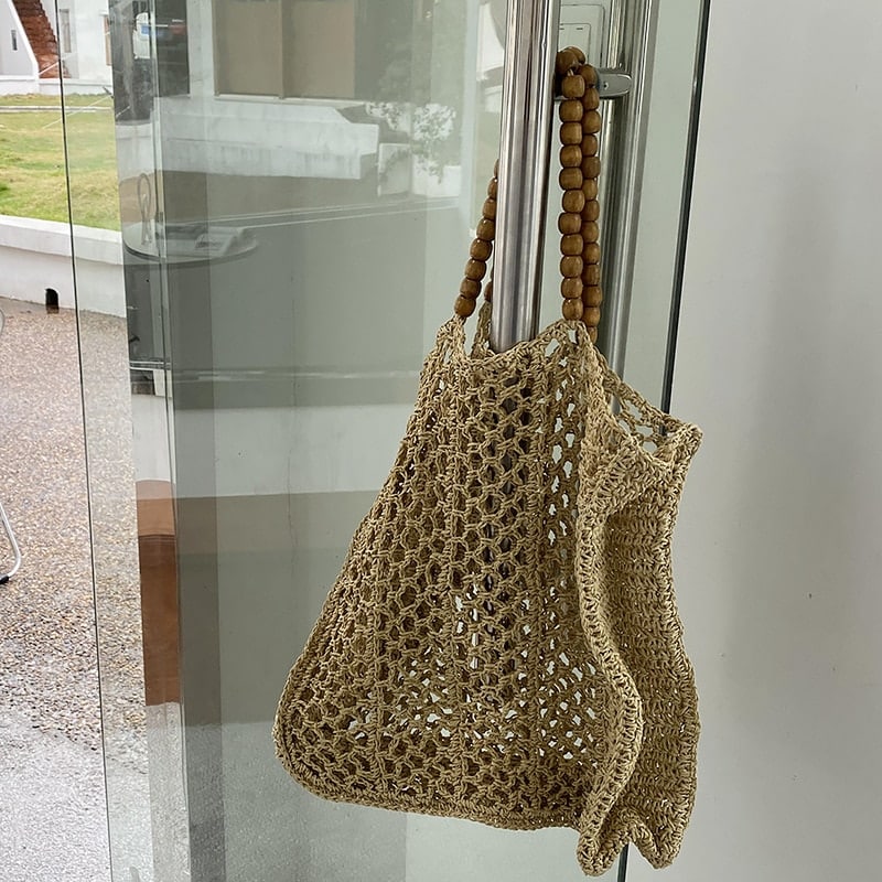 Large structured summer tote hand woven in natural straw with long handles