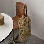 Large structured summer tote hand woven in natural straw with long handles