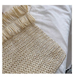 Large white woven straw shoulder bag with fringe trim
