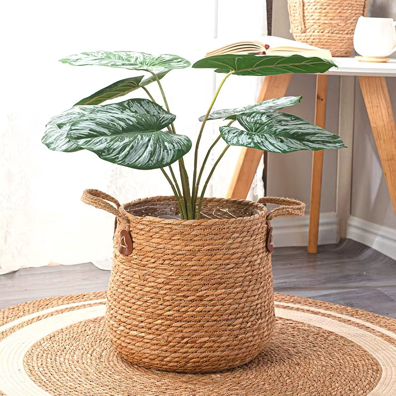 Large hand woven rattan floor planter with woven handles