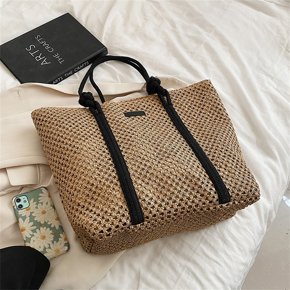 Large structured woven straw tote with sturdy handles and a fabric lining