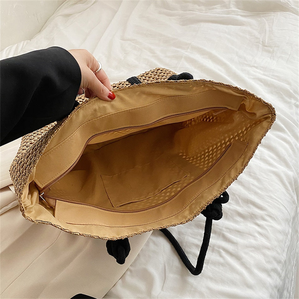 Large structured woven straw tote with sturdy handles and a fabric lining