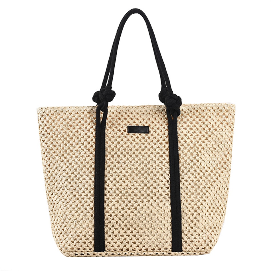 Large structured woven straw tote with sturdy handles and a fabric lining