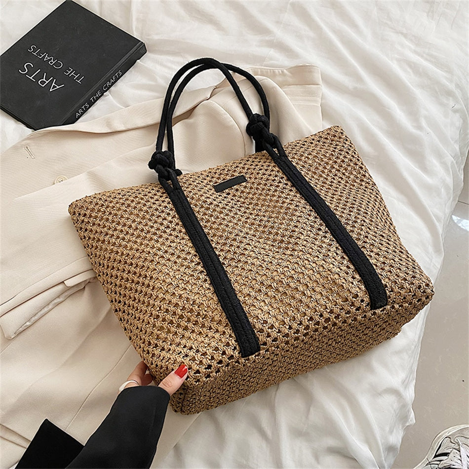 Large structured woven straw tote with sturdy handles and a fabric lining