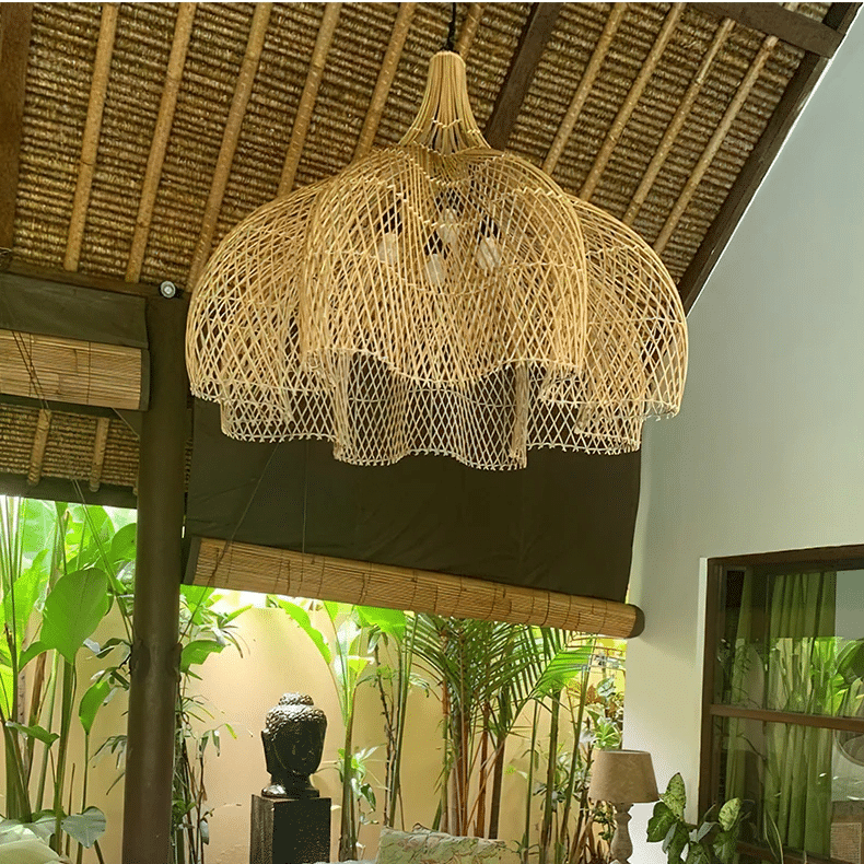 Large layered openwork rattan dome chandelier under a wooden roof