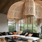 Large layered openwork rattan dome chandelier under a wooden roof