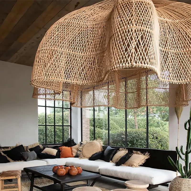 Large layered openwork rattan dome chandelier under a wooden roof