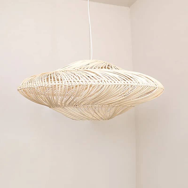 Wide layered rattan saucer pendant casting shadows on the ceiling