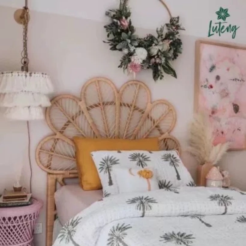 Leaf shaped headboard with six woven leaves hand woven in light rattan