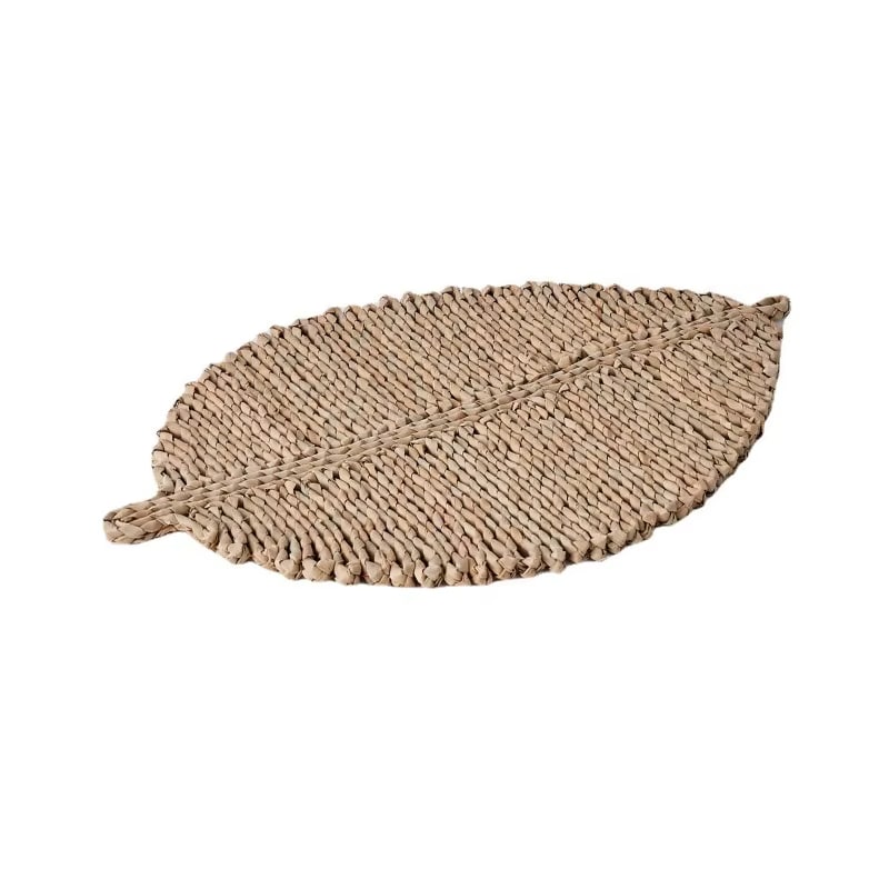 Leaf shaped placemat hand woven in golden straw with raised ribs