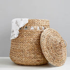 Large rounded woven rattan laundry basket with lid and knob