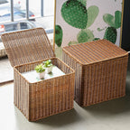 Rectangular woven storage basket with open lid holding papers