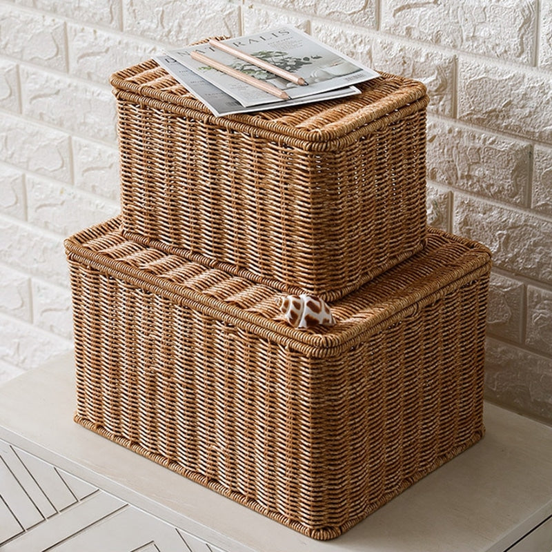 Rectangular woven storage basket with open lid holding papers