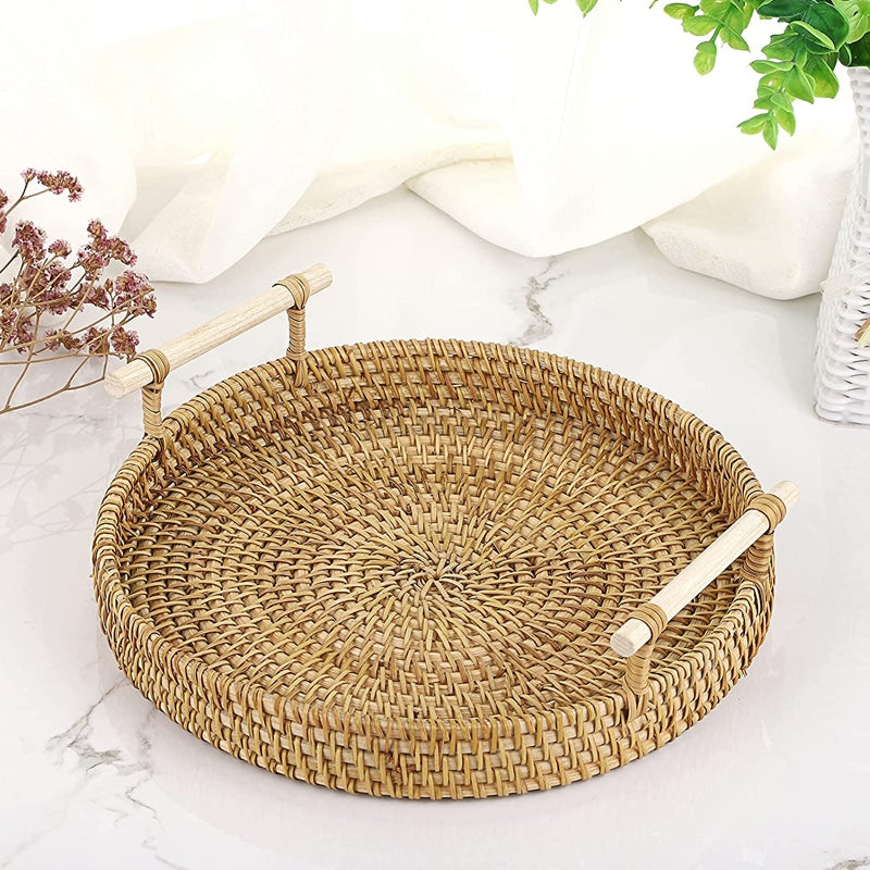 Round light beige rattan tray with wooden dowel handles