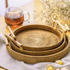 Round light beige rattan tray with wooden dowel handles
